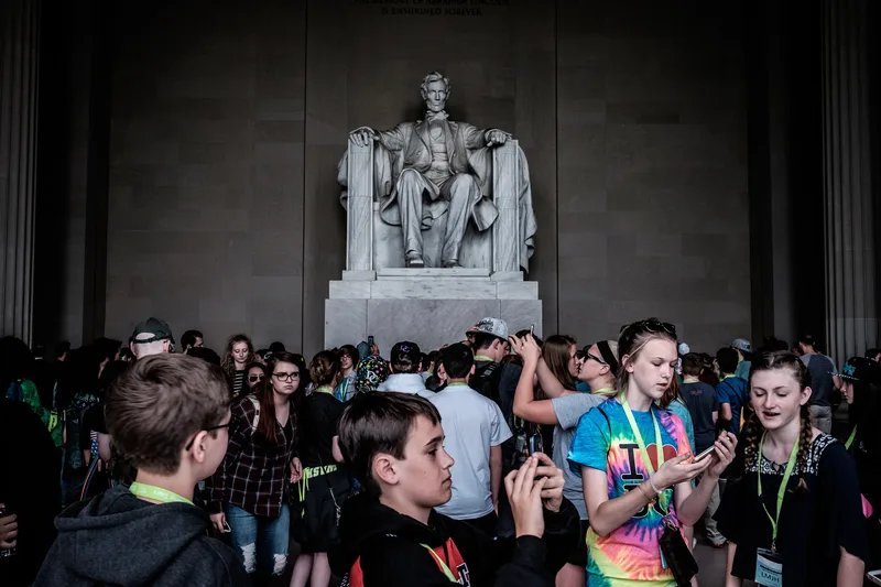 Crowd photographing the seated Lincoln Memorial statue