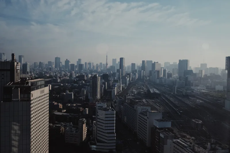 Vast city stretching to the horizon under haze