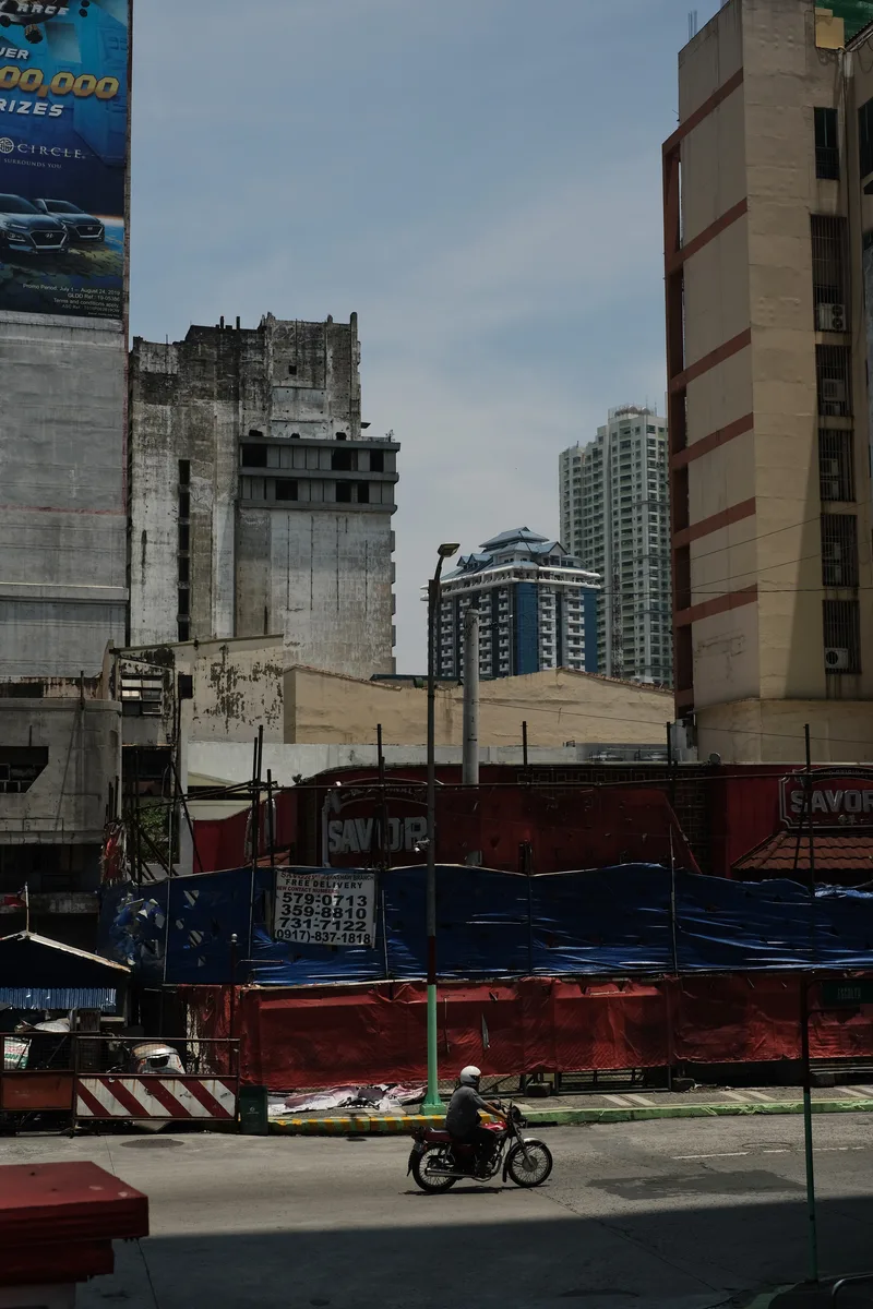Low city buildings and towers under a clear sky