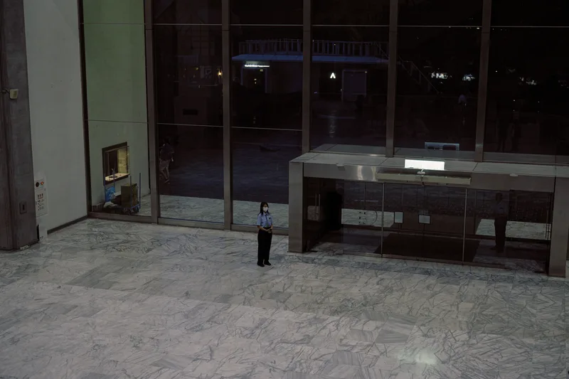 Empty lit interior seen through glass at night